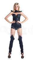 Sexy blond woman in leather corset stand isolated