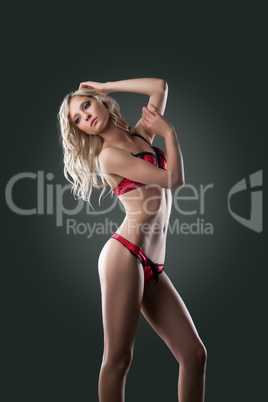 beauty blond woman posing in red lingerie