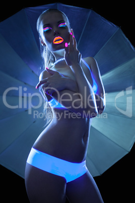 Girl with ultraviolet make-up disco dance