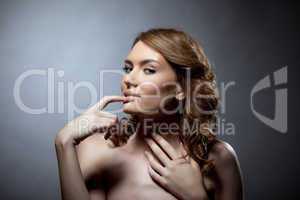 Pretty young woman bare portrait with finger