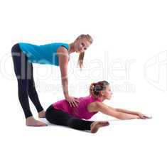 fitness instructor help woman doing stretch