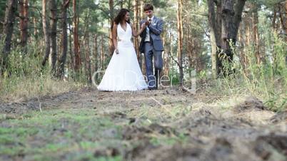 Married couple in pine forest