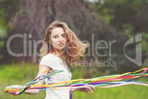 Beautiful girl with ribbons