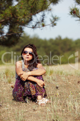 Beautiful Girl on a pine-wood