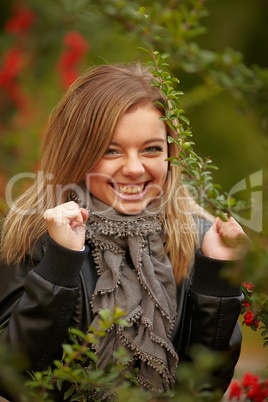 Beautiful positive girl in the bushes Viburnum