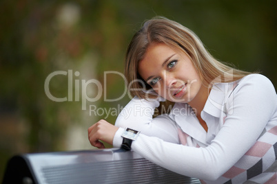 Beautiful girl sitting on the bench