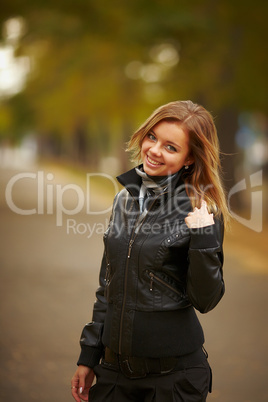 young brunette woman portrait in autumn color