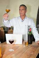 Winemaker analyzing wine