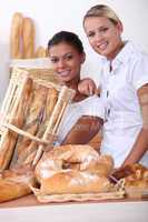 Two young women working in a bakery