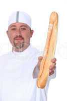 baker holding bread