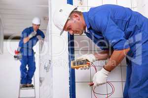 Two electrical inspectors on work site