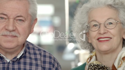 Seniors portrait with group of elderly people smiling in library