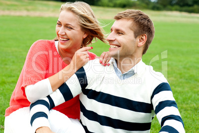 Woman pointing at her lovable husband