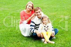 Portrait of happy young family with daughter