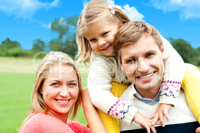 Beautiful happy caucasian family of three