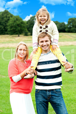 Pretty daughter enjoying day out with parents