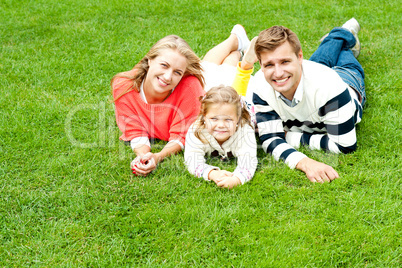 Laughing family of three having fun together