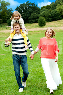 Portrait of family of three. Outdoor