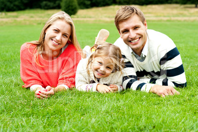 Young family of three spending a happy day outdoors