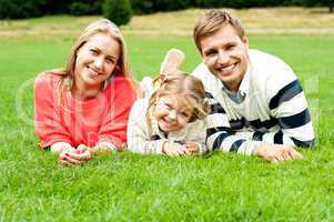 Young family of three spending a happy day outdoors
