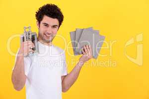 Young man with a tile cutter