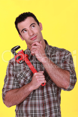 craftsman holding a spanner