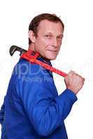 Worker with a pipe wrench