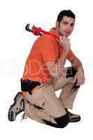 Man with an adjustable wrench