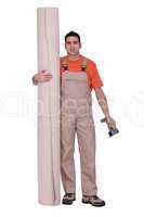 Man stood with carpet roll