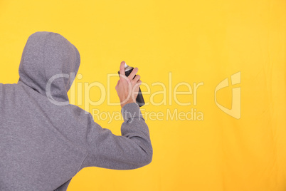 Man in a hoodie spray painting