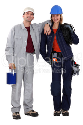 Painter and electrician standing side by side