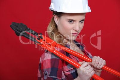 Portrait of woman with tongs over her shoulder