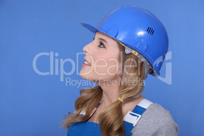 Portrait of a girl with helmet and overall