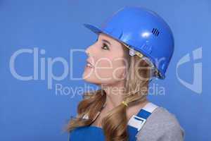 Portrait of a girl with helmet and overall