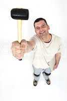 Handyman holding a mallet in the air