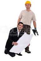 craftsman and businessman posing together