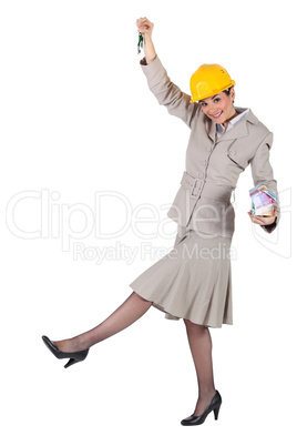 Woman jumping with keys in hand