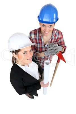 high angle shot of female architect and female bricklayer