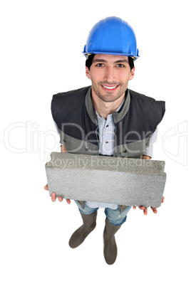 Builder with a block in his hands