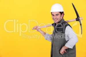 Cheerful man with a pickaxe