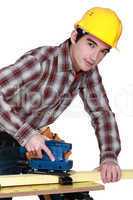 A trainee handling a jigsaw.