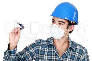 Young builder with a compass