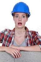 A wide-eyed tradeswoman