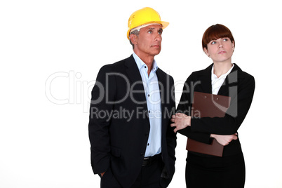 real estate businessman and assistant looking at something