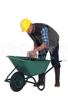 Builder with a wheelbarrow