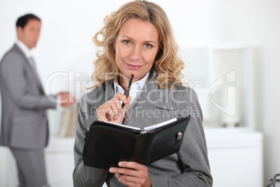 Blond woman with book in hand