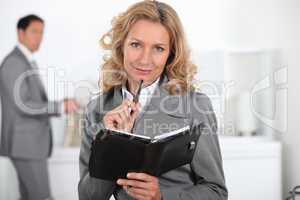 Blond woman with book in hand