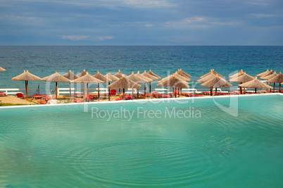 Swimming pool by a beach at the modern luxury hotel, Halkidiki,