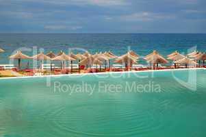 Swimming pool by a beach at the modern luxury hotel, Halkidiki,