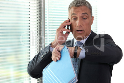 Businessman realizing he is late
